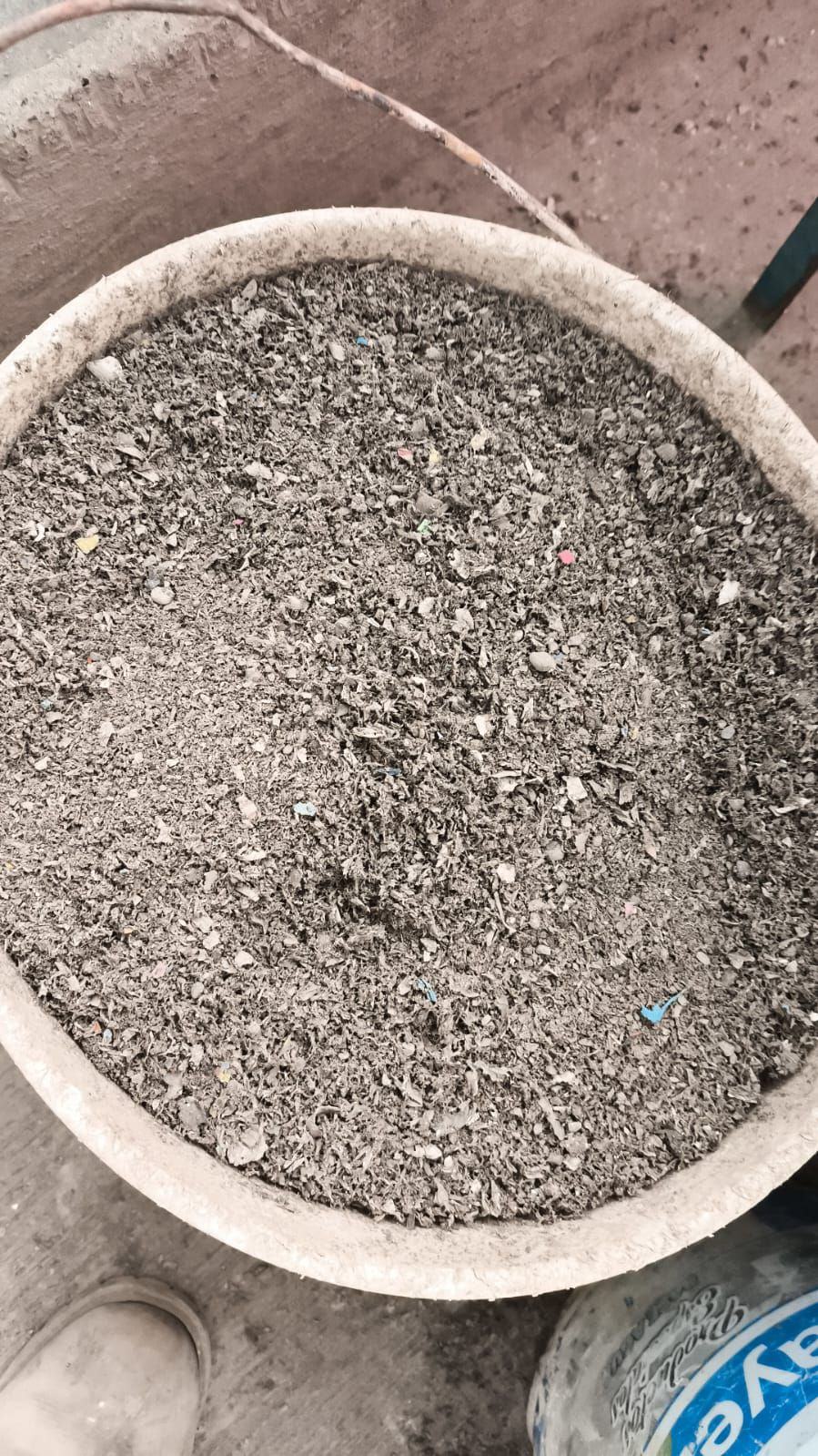 A bowl of fine grey granular Zyleno material